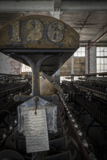 Machinery and tag at abandoned silk mill in Lonaconig Maryland