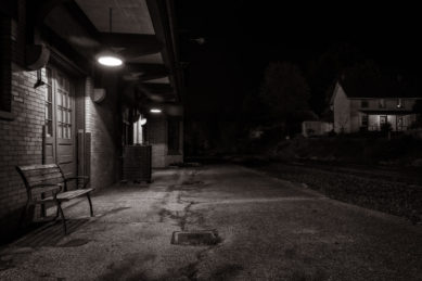 Abingdon Virginia railroad station with vacant bench at night