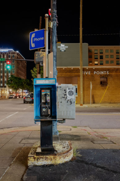 Pay telephone and street scene in Birmingham Alabama