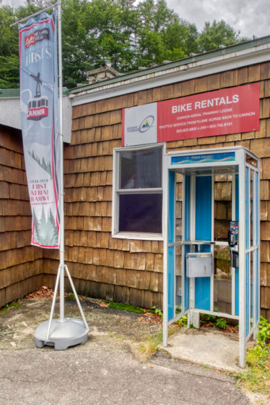 Telephone booth and signs at Cannon Mountain visitor center in New Hampshire
