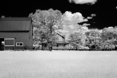 Barn and farmhouse in infrared scene at Frying Pan Farm Park in Herndon Virginia