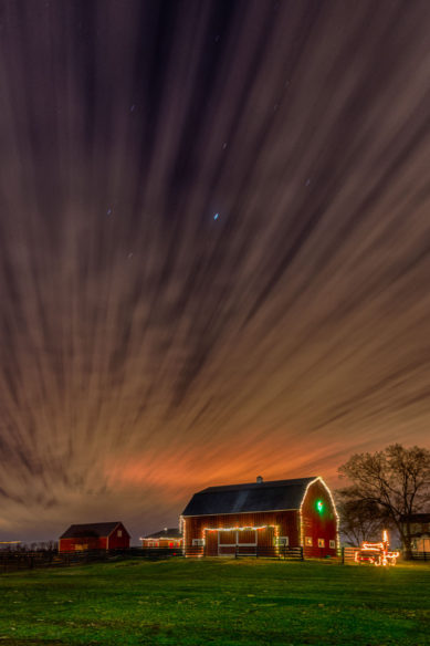Barn with Christmas lights and moving clouds at Frying Pan Farm Park in Herndon Virginia