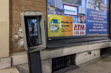 Crooked pay telephone outside quickmart in Lancaster Pennsylvania