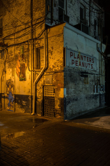 Alley with Planter's Peanuts ad in Nashville Tennessee at night