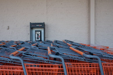 Pay telephone behind shopping carts at Home Depot in Reston Virginia