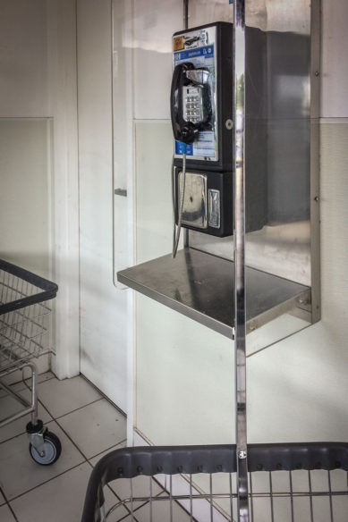 Pay telephone and carts in laundromat in Sterling Virginia
