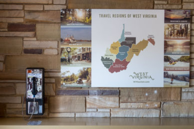 Pay telephone and travel ads at rest stop in Williamstown West Virginia